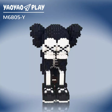 Black-and-white ​​Brick Bear toy​​ with pixelated patterns on a reflective surface and gradient blue backdrop.