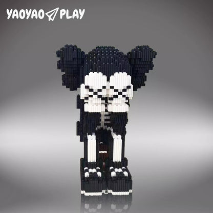 Pixel-art ​​Brick Bear toy​​ in black-and-white with precision joints on a neutral gray studio backdrop.