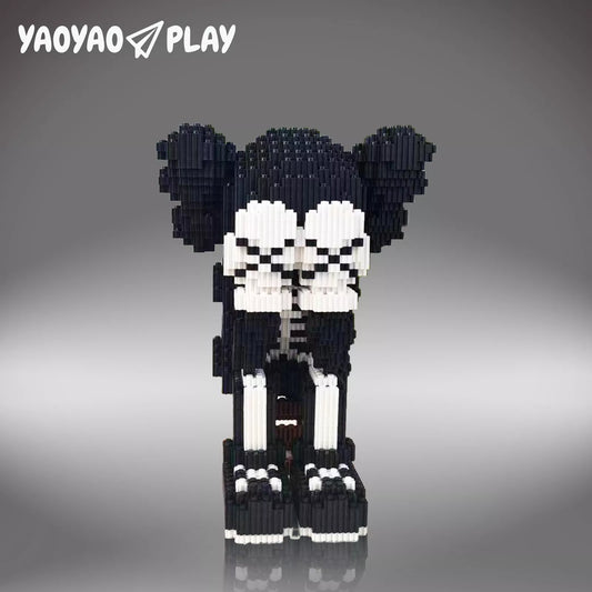 Pixel-art ​​Brick Bear toy​​ in black-and-white with precision joints on a neutral gray studio backdrop.