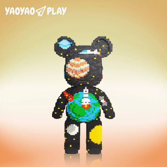 A pixel-style black Brick Bear toy with planetary details, aurora-textured ears, and "YAOYAO PLAY" branding.