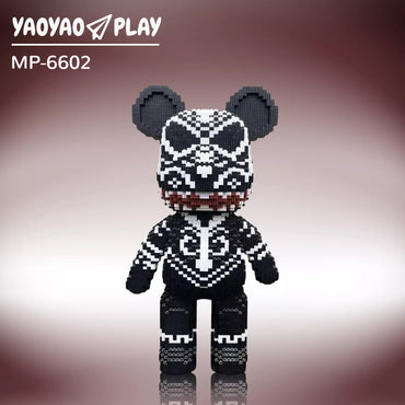 A black-and-white ​​Brick Bear toy​​ (Model MP-6602) with red-accented mouth and geometric patterns on a burgundy gradient.